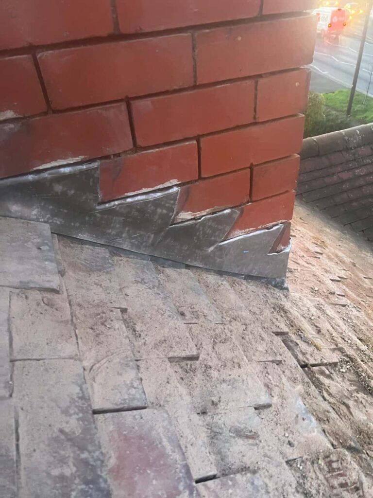 This is a photo of new leadwork being installed around an old chimney. Works carried out by LS Roofing Earley